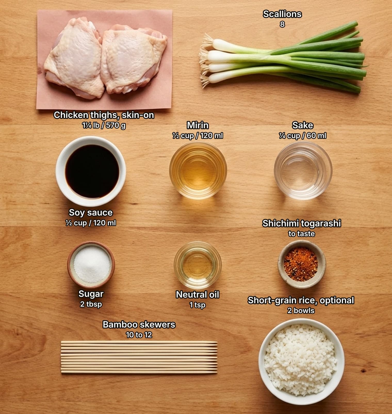 Yakitori ingredients laid out overhead on a wooden counter and labelled with quantities: two raw skin-on chicken thighs on butcher paper and a bunch of scallions across the top; a bowl of soy sauce and glasses of mirin and sake in the second row; small bowls of sugar, oil and red shichimi togarashi in the third row; a bundle of bamboo skewers and a bowl of cooked short-grain rice below.